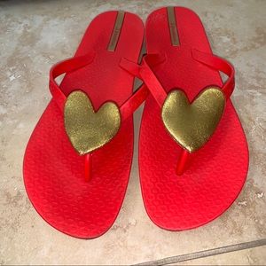 Ipanema red flip flops with gold sparkly heart